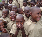 Kids play outside a FacilitAid school